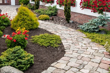 Professionally installed landscaping and hardscaping by J.T. & Sons Lawn Care in Bloomington, IL