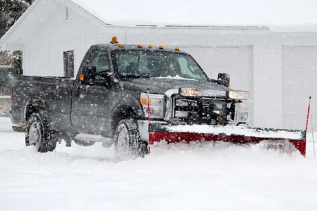 J.T. & Sons Lawn Care performing snow removal service in Bloomington, IL