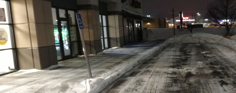 Professionally administered snow removal and deicing of a commercial parking lot in Bloomington-Normal, IL.