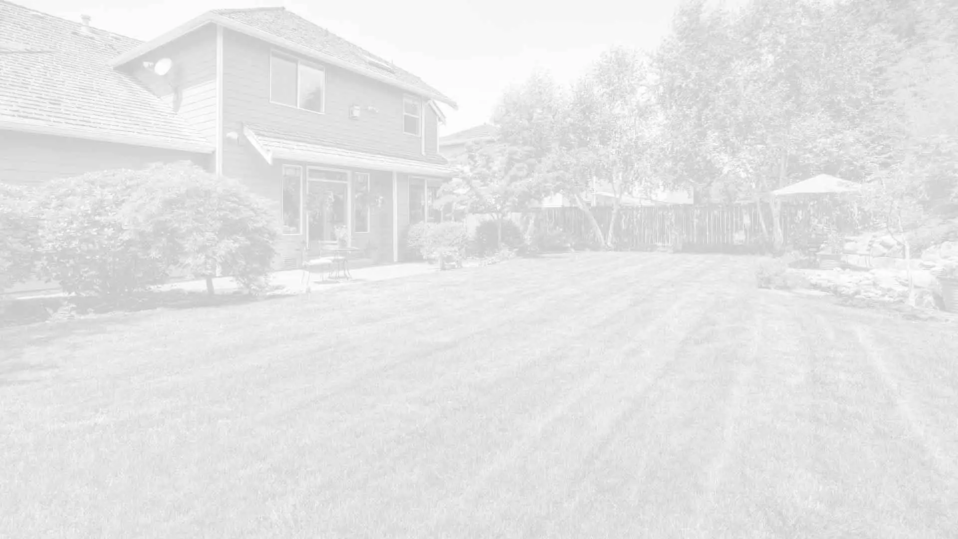 Homeowner in Bloomington with lawn service by J.T. & Sons Lawn Care.